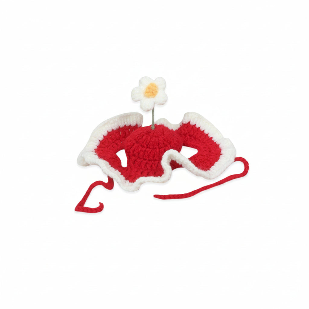 Petit chien portant un bonnet fleur en crochet